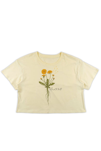 Beige t-shirt with dandelion design and "Hard to kill" text on a white background
