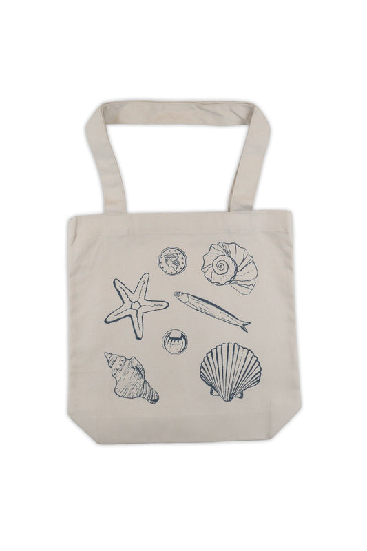Beige tote bag with black line drawings of seashells and a starfish on a white background